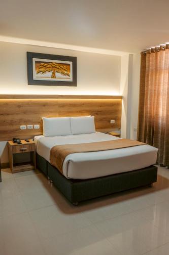 a bedroom with a large bed in a room at Antawa Hotel in Moquegua