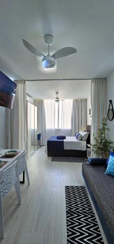 a bedroom with a bed and a ceiling fan at Copacabana Vibes Studios in Rio de Janeiro