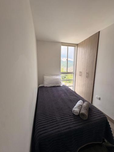 Ένα ή περισσότερα κρεβάτια σε δωμάτιο στο Apartamento Urban Manizales Acogedor