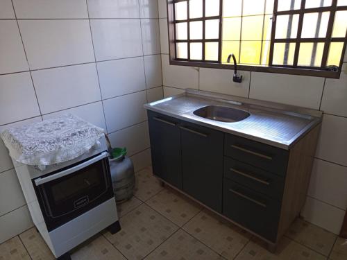 casa para seu descansoにあるキッチンまたは簡易キッチン