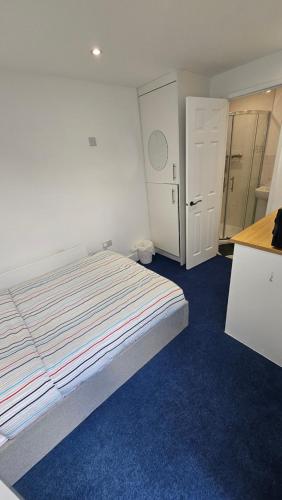 a bedroom with a bed and a closet and a door at Restful Place in Wainscot