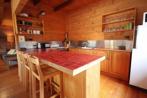 a kitchen with wooden cabinets and a counter top at At The Beach in Evergreen