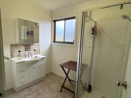 a bathroom with a sink and a shower at Condon 53 in Evergreen