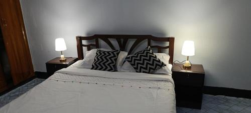 Postel nebo postele na pokoji v ubytování Noor Aman Guest House