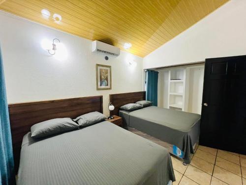 Postel nebo postele na pokoji v ubytování Villas Don Julio