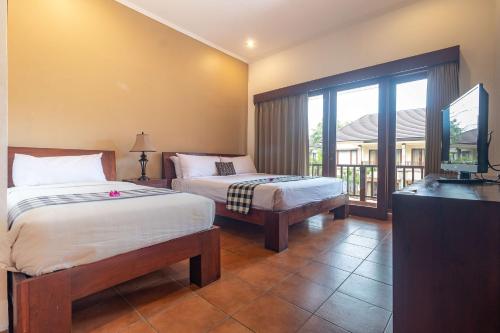 Giường trong phòng chung tại Vidi Boutique Hotel