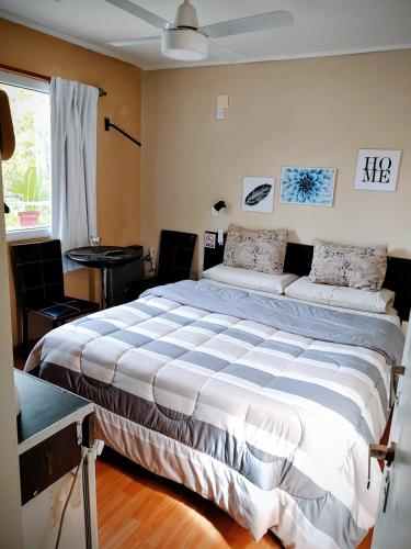 a bedroom with a large bed in a room at Microbed in Cipolletti
