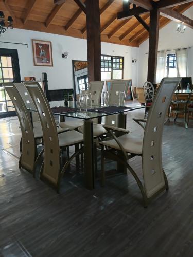 a dining room with a table and chairs at CROOКED TREE LODGE Belize in Crooked Tree