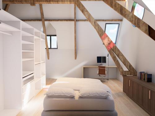 a bedroom with a bed in a attic at Spacious 3-Floor Holiday Home for 8 Guests in Bree