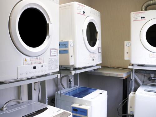 a hospital room with machines and machines at Moriyama Art Hotel in Moriyama