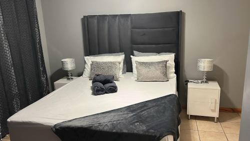 En eller flere senge i et værelse på Cottage 25