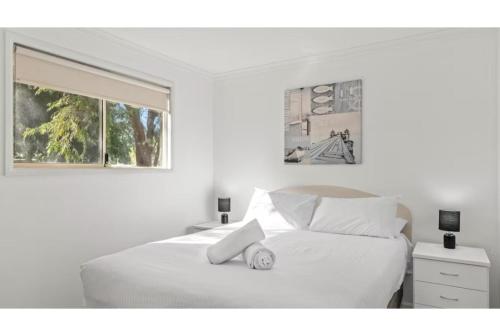 Ένα ή περισσότερα κρεβάτια σε δωμάτιο στο Discovery Parks - Woodman Point