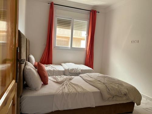 Postel nebo postele na pokoji v ubytování mirleft baech chikh