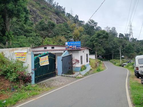 a small building on the side of a road at Varshini home stay in Kotagiri