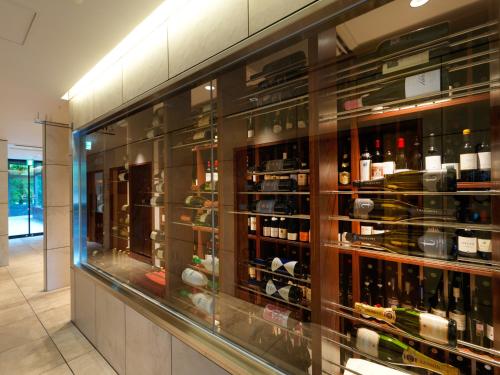 a display case in a store with lots of wine bottles at Hakodate Onuma Tsuruga Resort EPUY- 30km from Hakodate Station in Hakodate