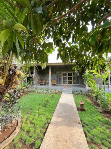 a walkway leading to the front of a house at Menjangan Dive Lodge in Banyuwedang