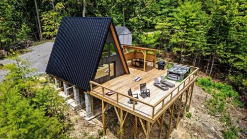 an overhead view of a house with a black roof at Modern A-Frame Cabin with Breathtaking Views of the Smoky Mountains, Perfect for Families or Groups in Hartford
