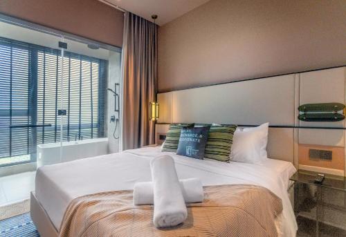 Postel nebo postele na pokoji v ubytování Antara Genting by CHG