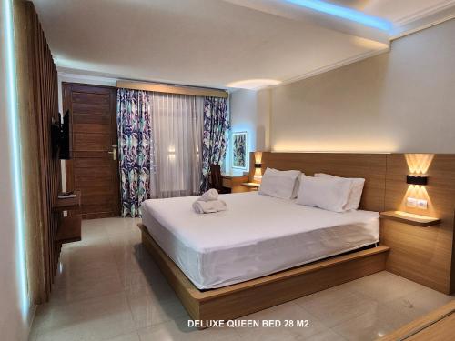 Postel nebo postele na pokoji v ubytování Bali Balitung