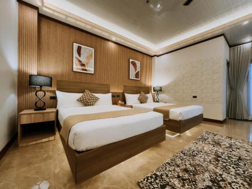 Postel nebo postele na pokoji v ubytování Rosepine Hotel