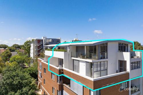 a building with a blue line on the side of it at Crows Nest - Executive Penthouse - 3 Bedroom- 5km to City in Sydney