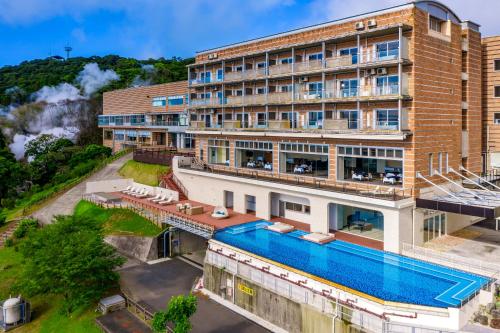 an aerial view of a hotel with a swimming pool at Bettei Amafuru Oka in Ibusuki