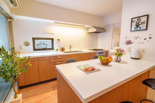 Kuchyň nebo kuchyňský kout v ubytování Higashi-Shinjuku 906