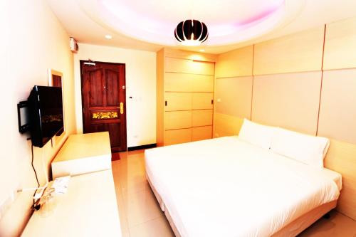 Ένα ή περισσότερα κρεβάτια σε δωμάτιο στο T3 Residence