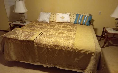 a bedroom with a large bed with pillows on it at Prada Home Club in Punta Gorda