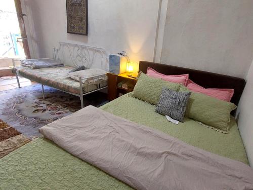 Postel nebo postele na pokoji v ubytování Cassa Bonda Std Family Room