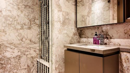 a bathroom with a sink and a shower at Eaton Residence Kuala Lumpur - M Home in Kuala Lumpur