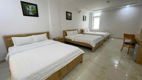Postel nebo postele na pokoji v ubytování Oceanic Hotel Vung Tau