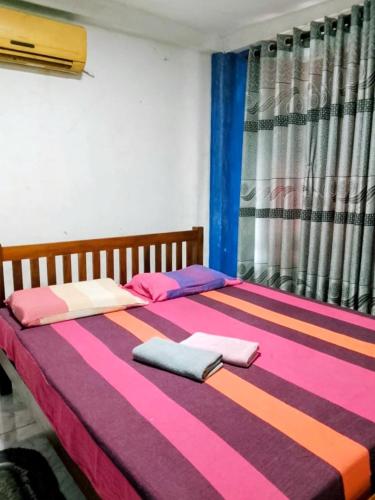 Ένα ή περισσότερα κρεβάτια σε δωμάτιο στο Lake Front Hotel IDH