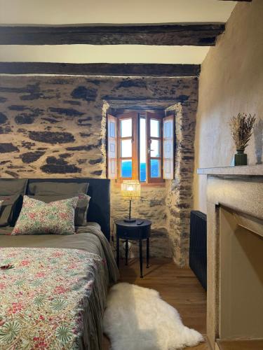 a bedroom with a bed and a window at Village House With Character In Corsica in Scolca