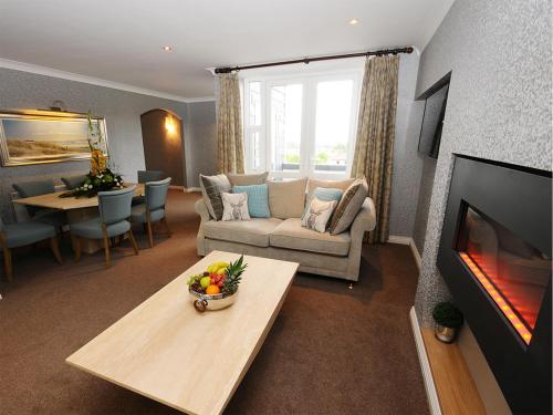 a living room with a couch and a table at Flannery's Hotel in Galway