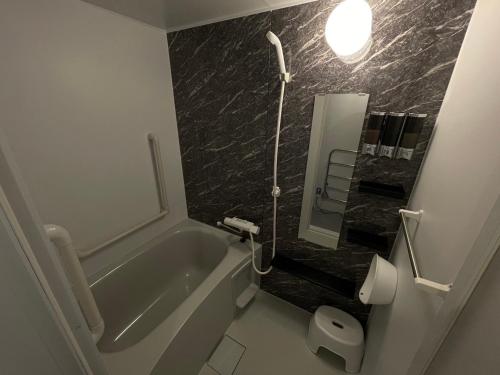 Et badeværelse på 佐藤理容Inn