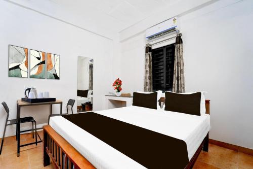 Postel nebo postele na pokoji v ubytování Super Collection O Isha Yoga Center Coimbatore Formerly Nischala Stay