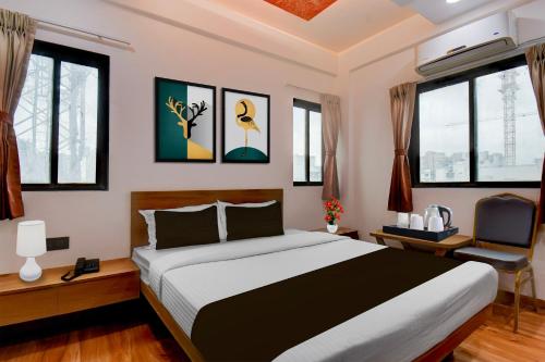 Ένα ή περισσότερα κρεβάτια σε δωμάτιο στο Townhouse Balewadi Stadium Pune Formerly Hotel Sarovar