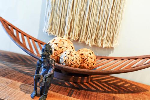 a small figurine next to a bowl of spaghetti at 4A Wood St-PetsNegotiable Linen Included Wi-Fi - Linen Included in Kilki