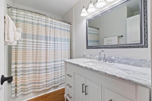 a bathroom with a sink and a mirror at SG10C: 10C Seagrove Villa in Isle of Palms