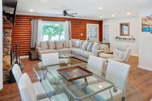 a living room with a couch and a glass table at Modern Cabin Bungalow in Mariposa