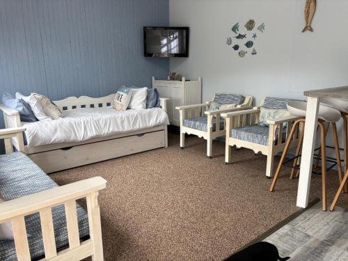 Postel nebo postele na pokoji v ubytování Driftwood Cottage