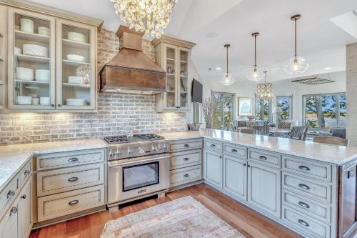a kitchen with white cabinets and a stove top oven at MG3083: 3083 Marshgate in Seabrook Island
