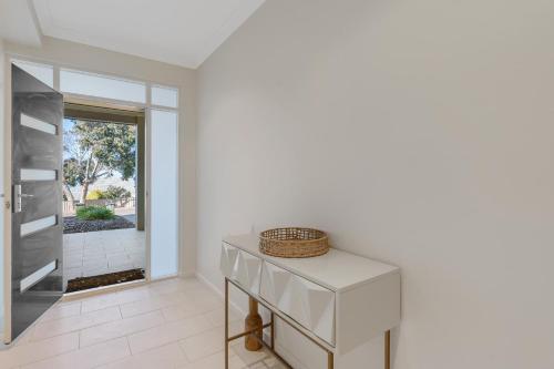 a white kitchen with a counter and a window at Bluffview B&B - Luxury Oceanviews - Wi-Fi - No Linen Included in McCracken