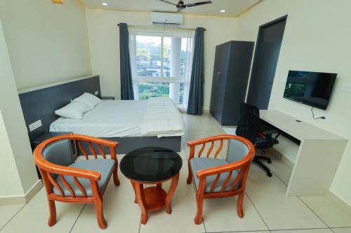 TV a/nebo společenská místnost v ubytování RIVULET HOTEL APARTMENTS