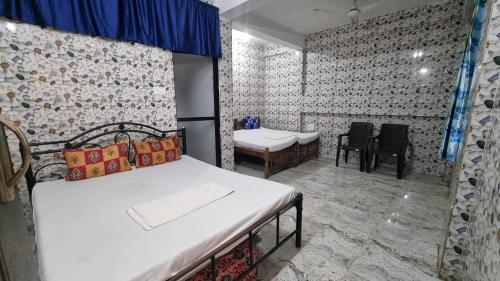 Ένα ή περισσότερα κρεβάτια σε δωμάτιο στο Sachi home stay