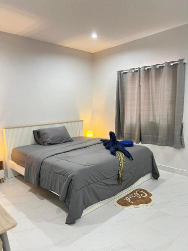 Ένα ή περισσότερα κρεβάτια σε δωμάτιο στο Samakki Residence