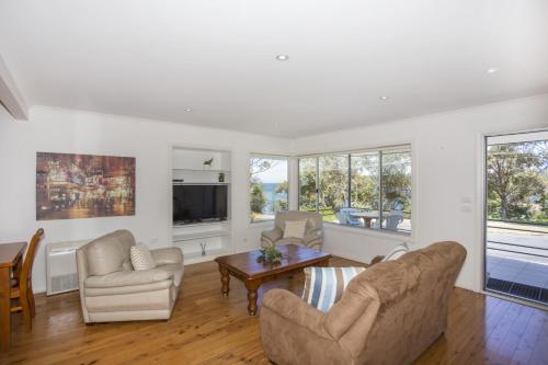 Μια τηλεόραση ή/και κέντρο ψυχαγωγίας στο Harbour Haven - steps from Ulladulla Harbour