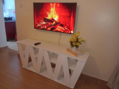 Μια τηλεόραση ή/και κέντρο ψυχαγωγίας στο Oasis gardens Deliverance road