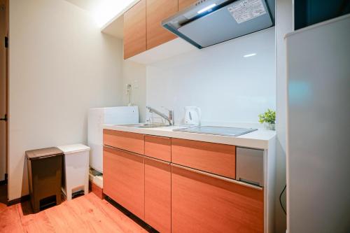 Η κουζίνα ή μικρή κουζίνα στο 中野ワールドホテル